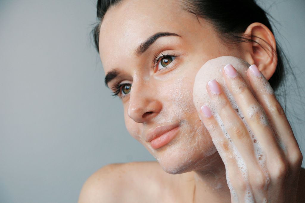 Face Cleansing with soap and sponge small